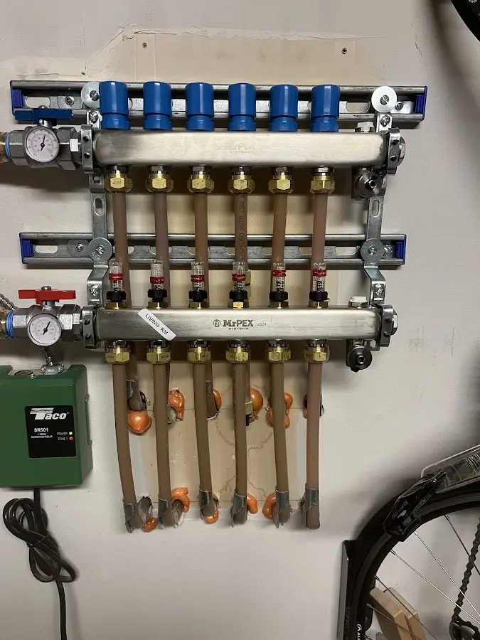 Plumber performing Water Heater Repair at a residential property in Moravia